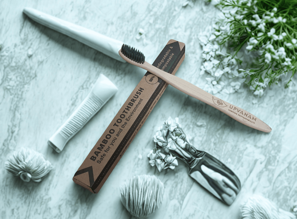 bamboo toothbrushes on a textured surface with decorative elements